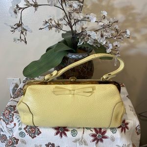 Vintage leather clutch bag in canary yellow